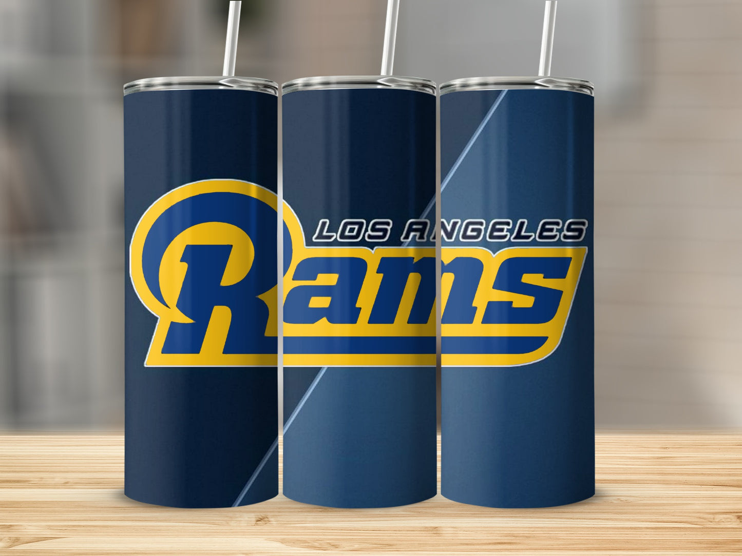 Los Angeles Rams logo on three dark blue tumblers with straws.