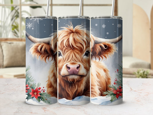 Highland cow with snowflakes and poinsettias on a tumbler.