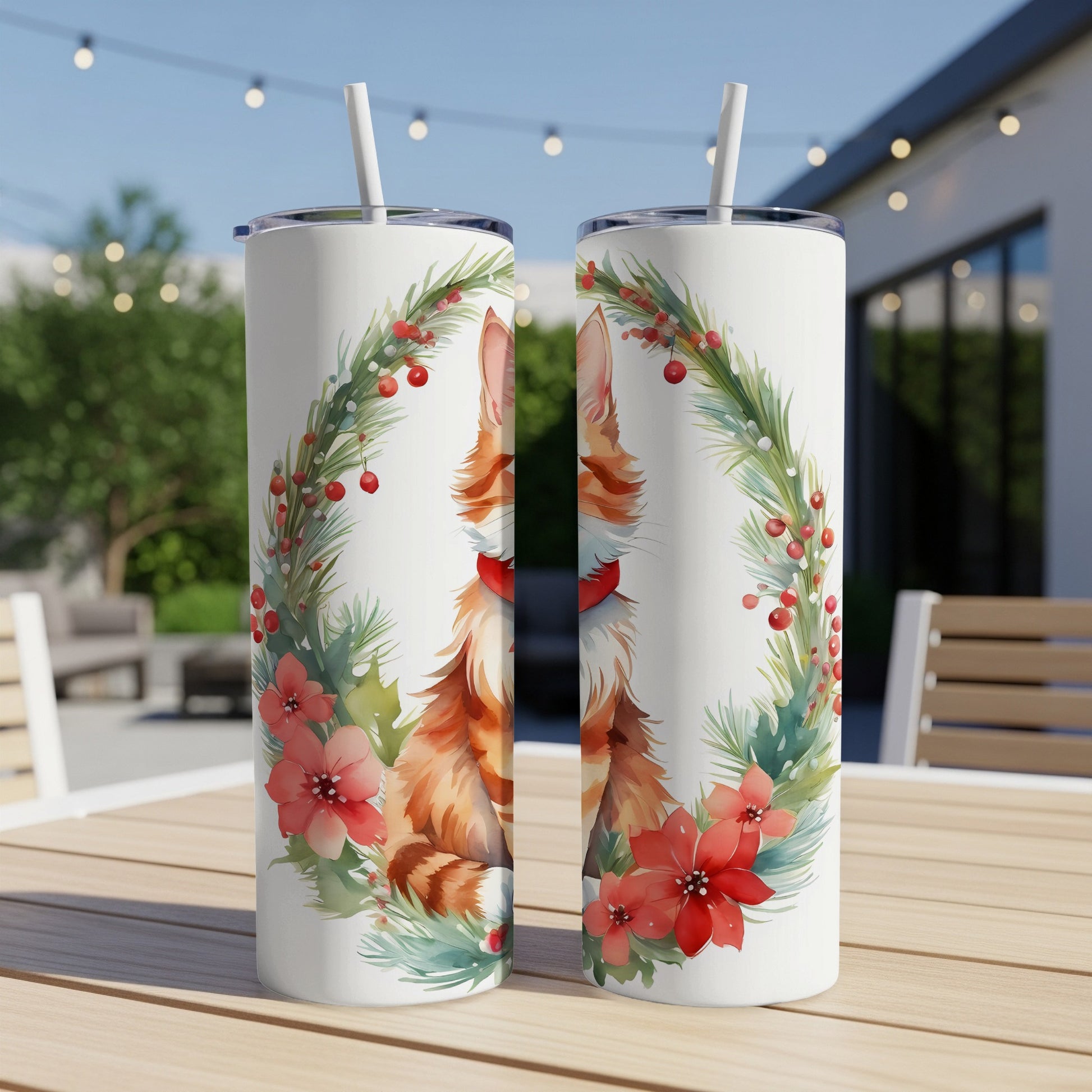 Two tumblers featuring a watercolor illustration of a cat in a festive wreath.