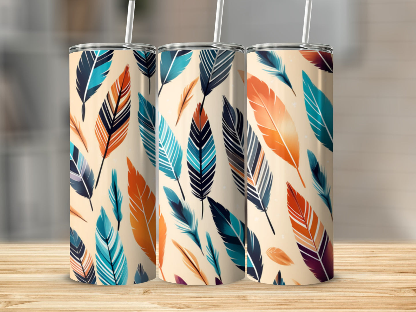 Three tumblers with a repeating pattern of colorful feathers.