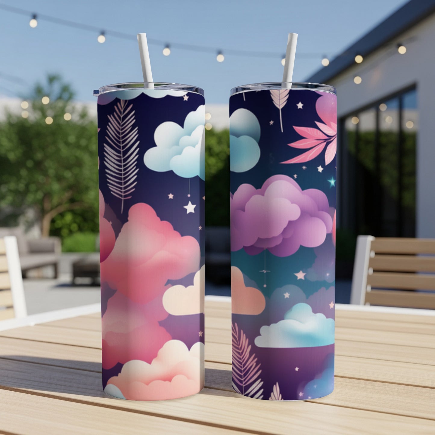 Two tall tumblers with a starry night sky and cloud pattern.