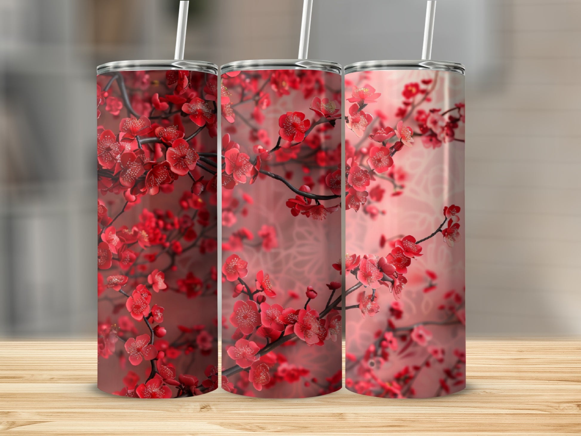 Three tumblers with a red floral cherry blossom design.