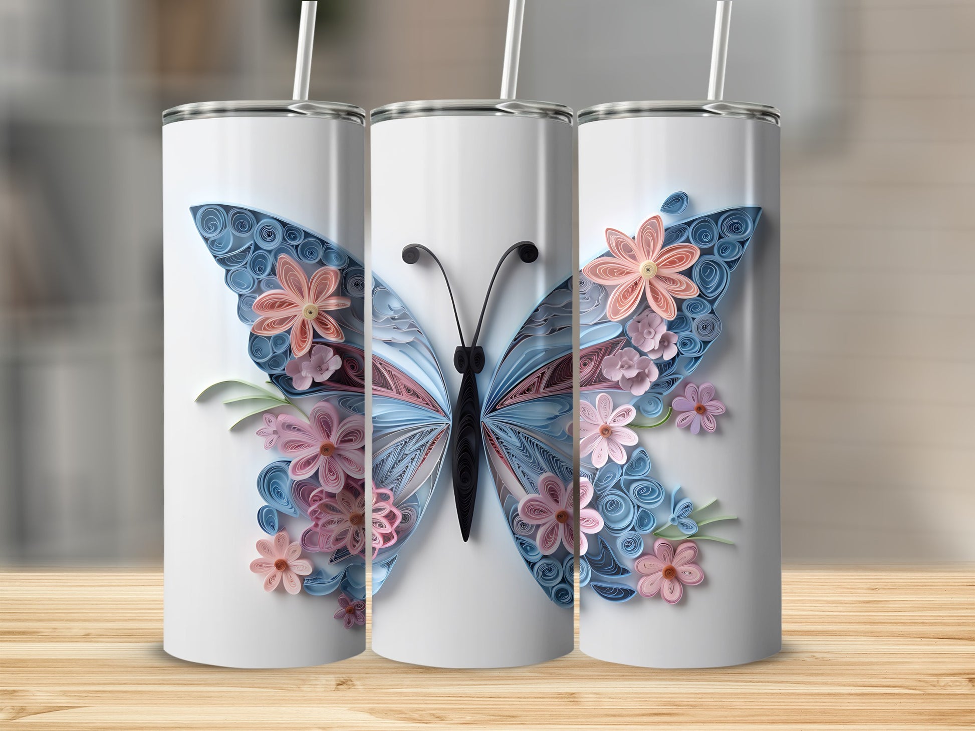 Three white tumblers with a quilled butterfly and floral design.