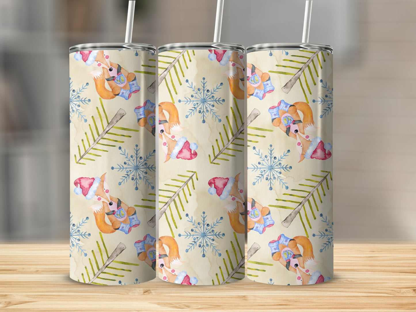 Three tumblers with a festive fox and snowflake pattern.