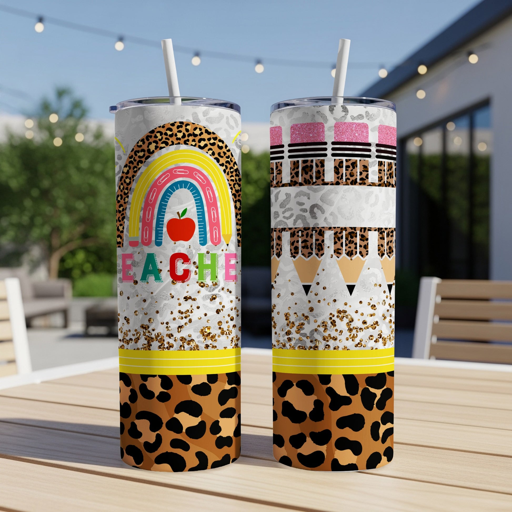 Teacher tumbler with rainbow, apple, and leopard print design.