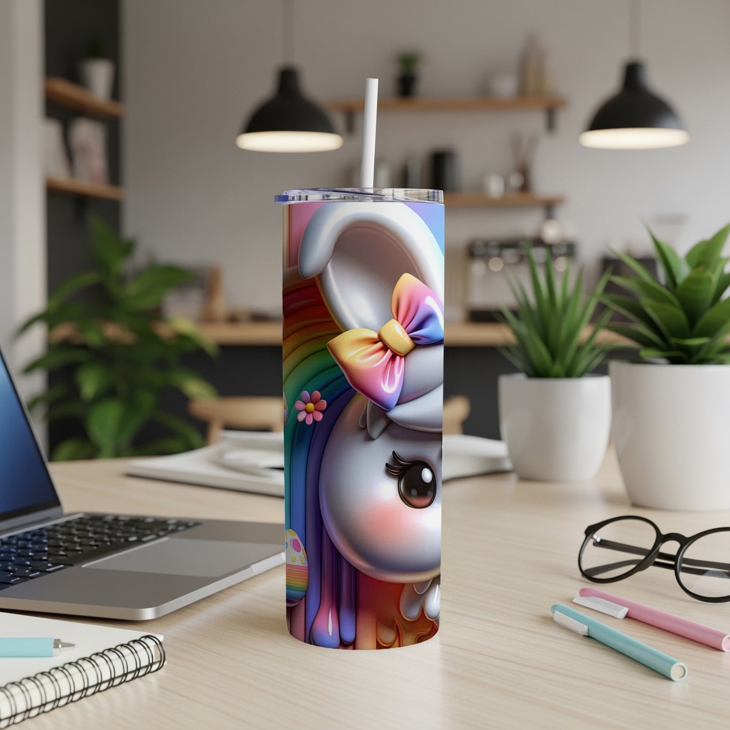 Tall tumbler featuring a cartoon bunny with rainbow accents and a bow.