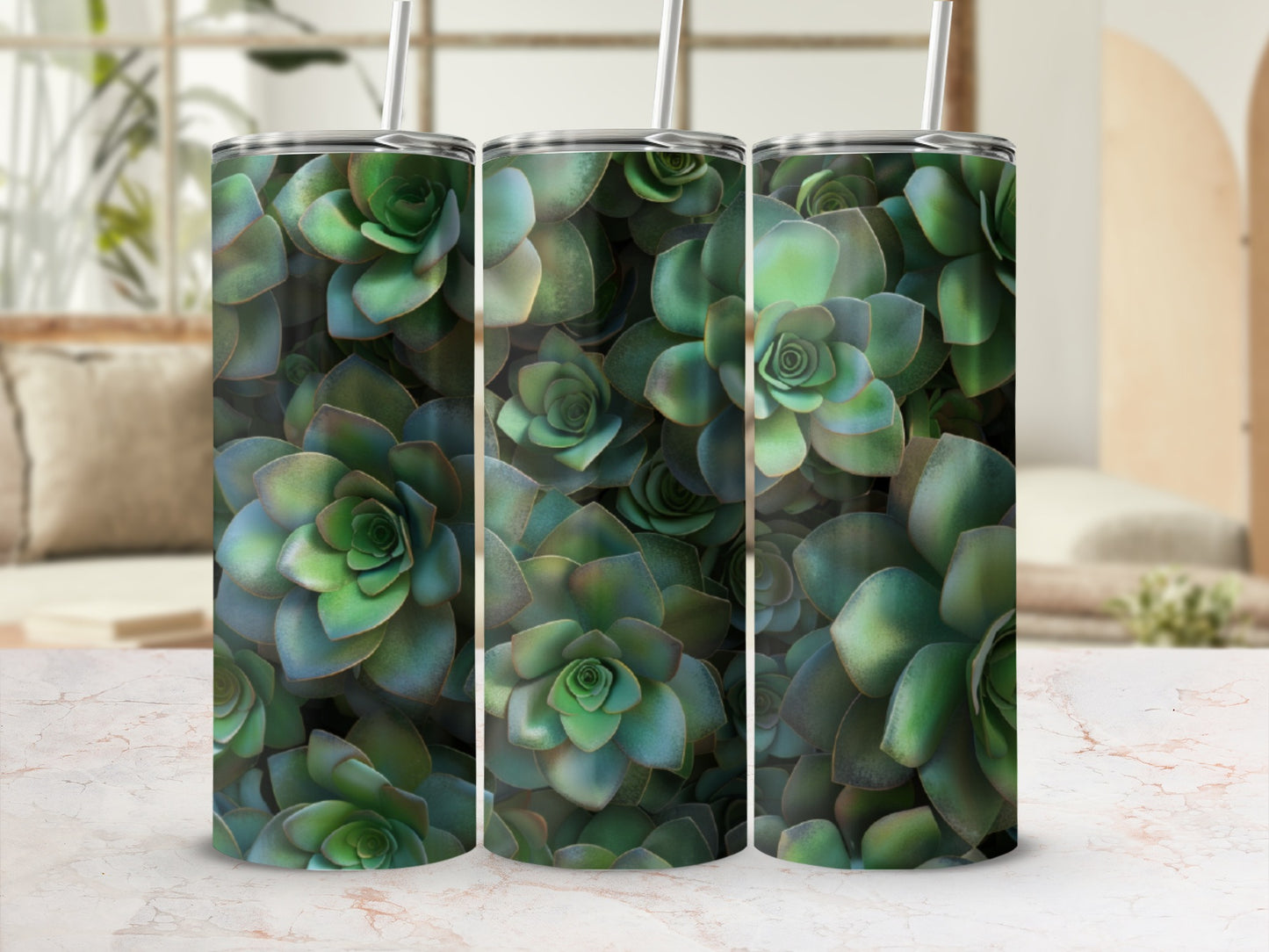 Green succulent plant pattern on three tumblers with straws.