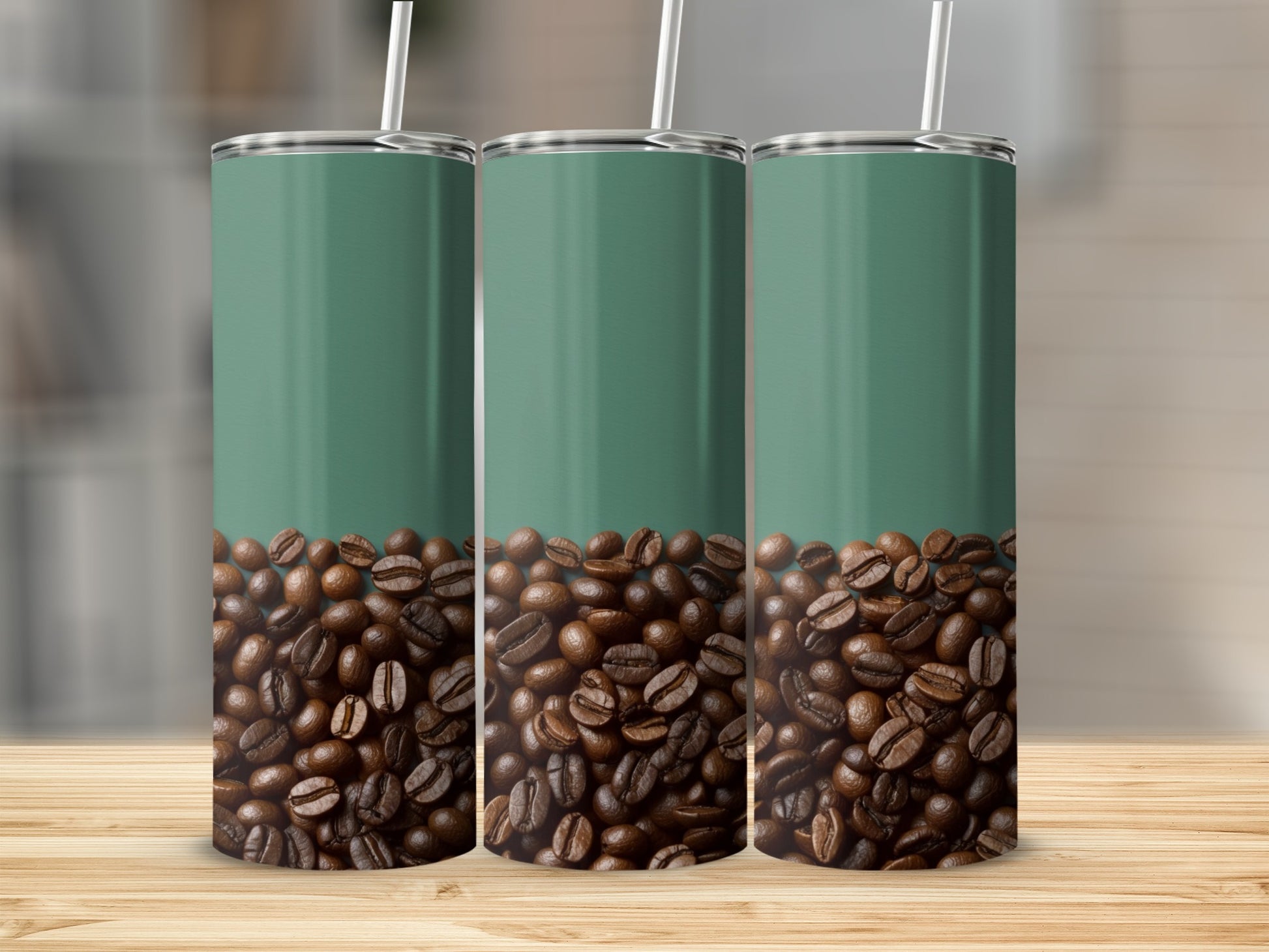 Three green tumblers filled with coffee beans on a wooden surface.