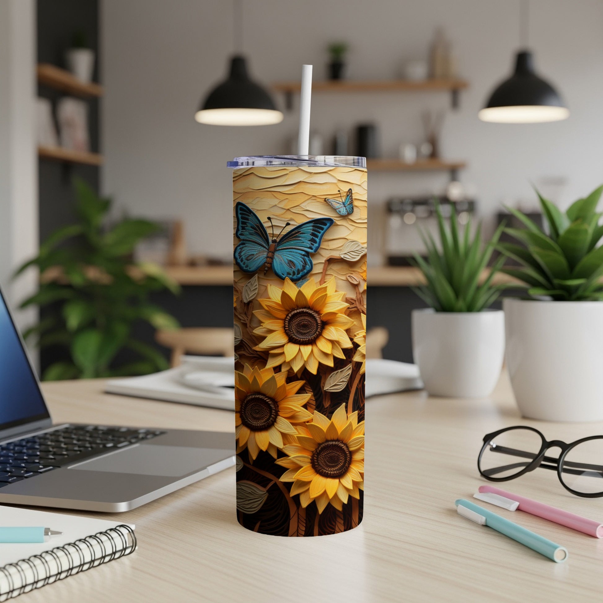 Sunflower and butterfly design on a white tumbler with a straw.