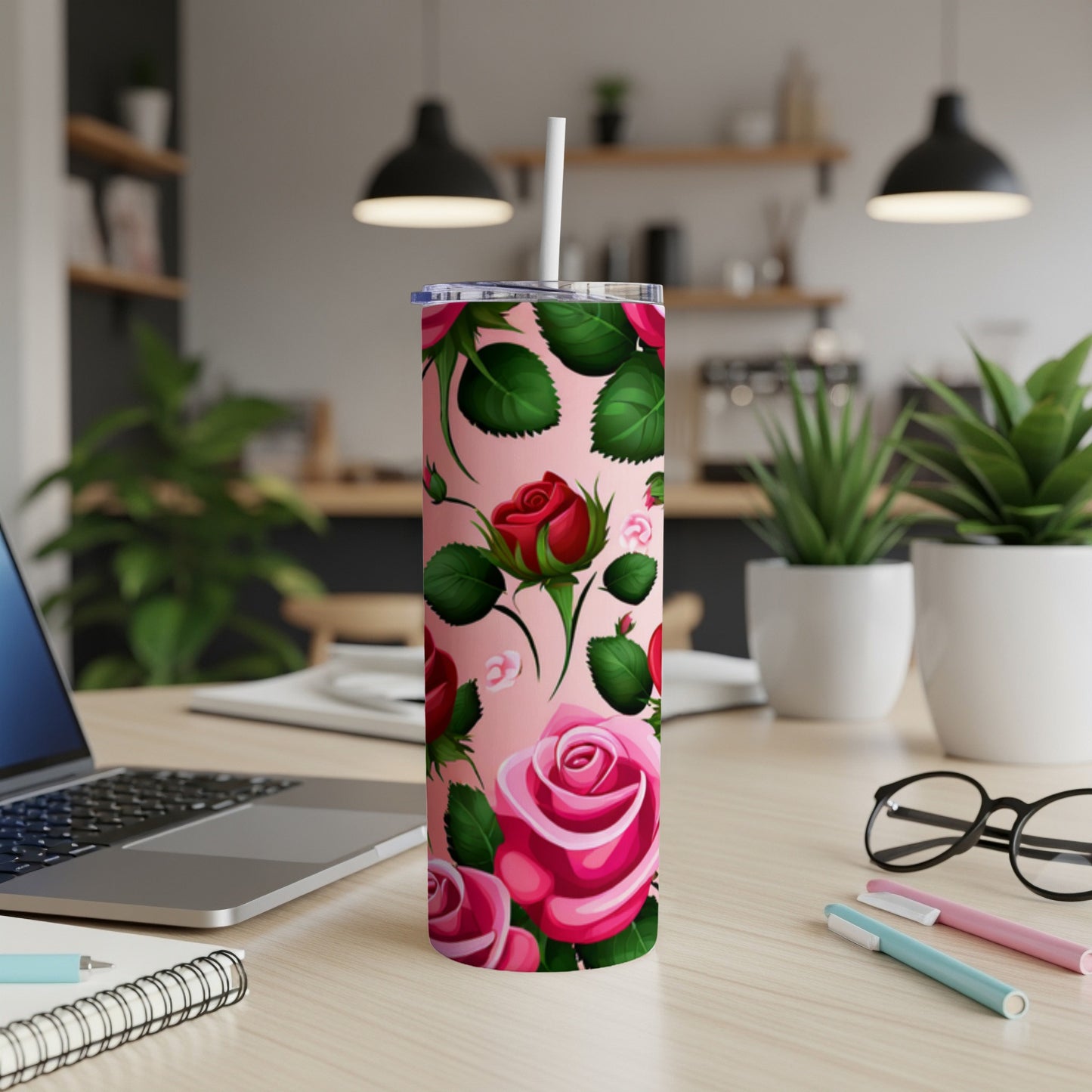 Pink tumbler with a bold rose floral pattern and white straw.