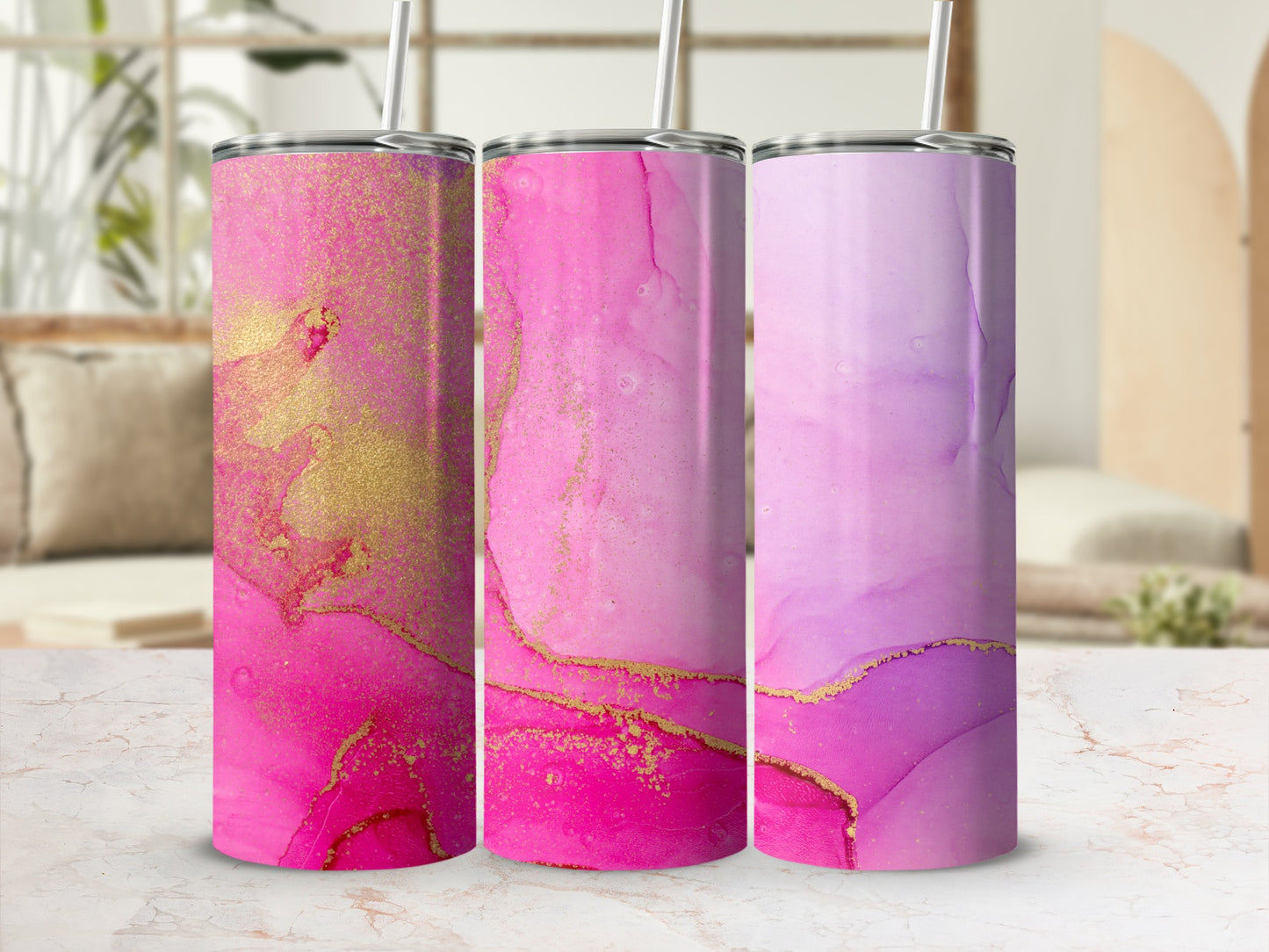 Three tumblers with pink and gold marbled patterns.