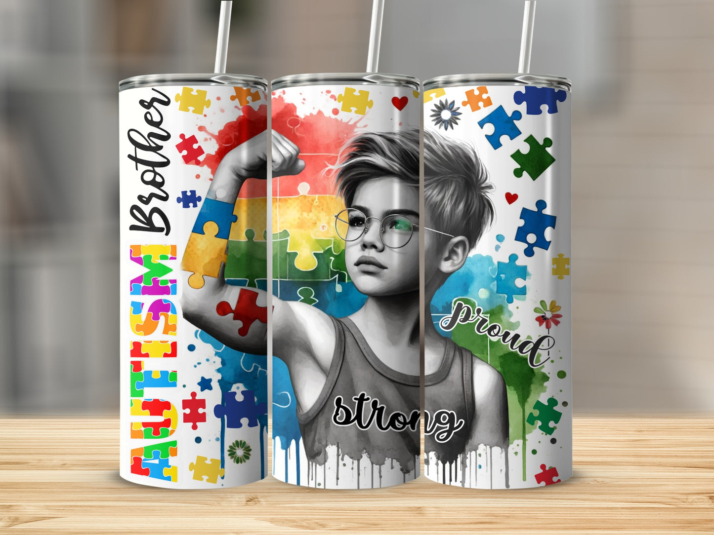 Autism Brother Proud Strong tumbler with puzzle pieces and watercolor splashes.