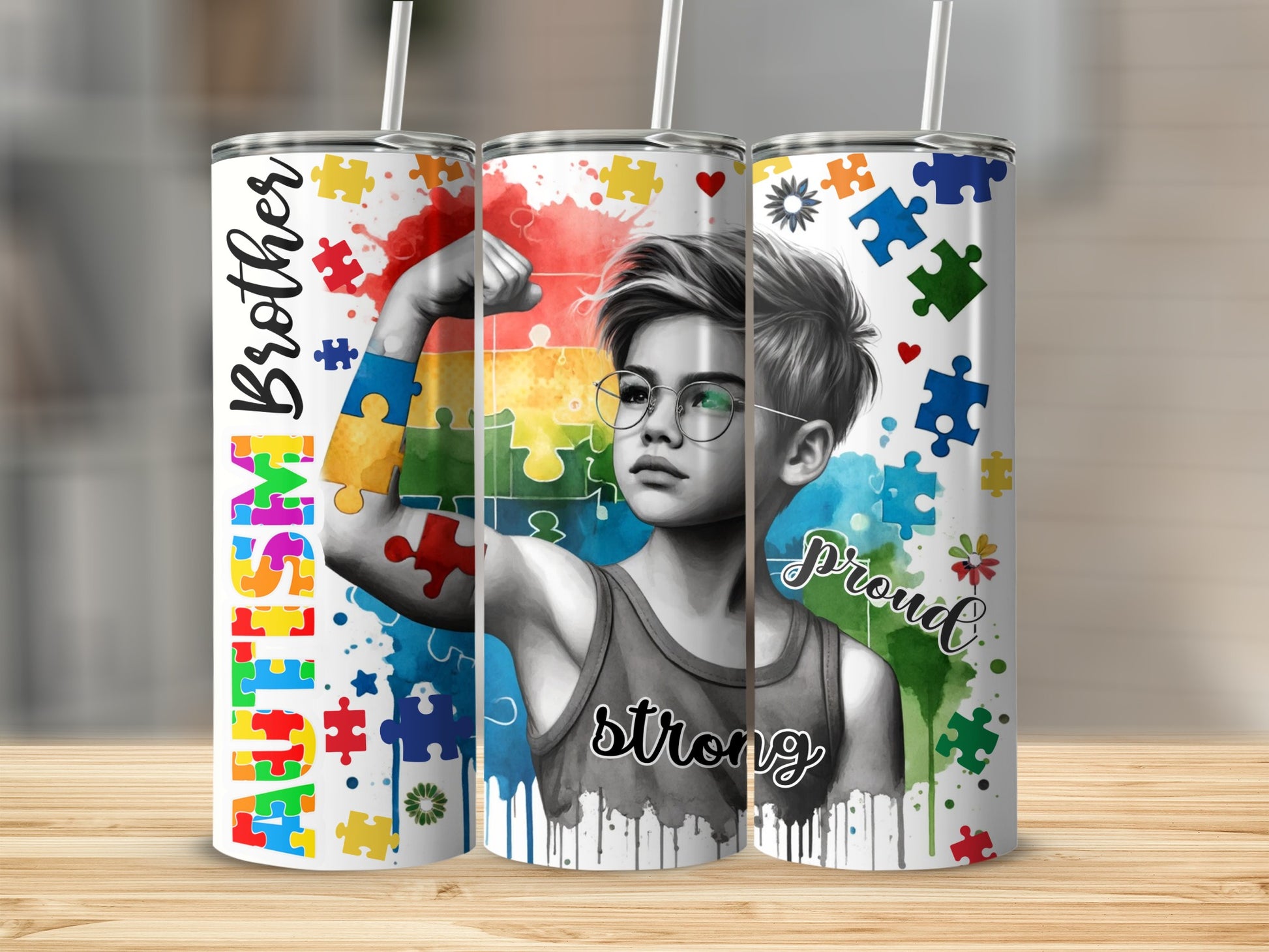 Autism Brother Proud Strong tumbler with puzzle pieces and watercolor splashes.