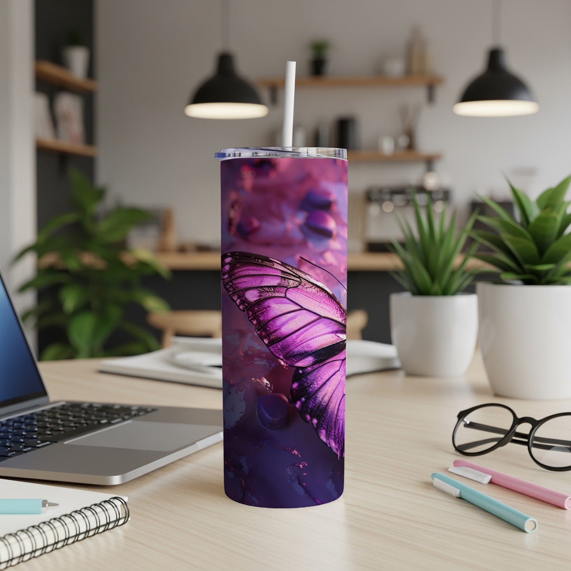 Purple butterfly pattern on a stainless steel tumbler with straw.