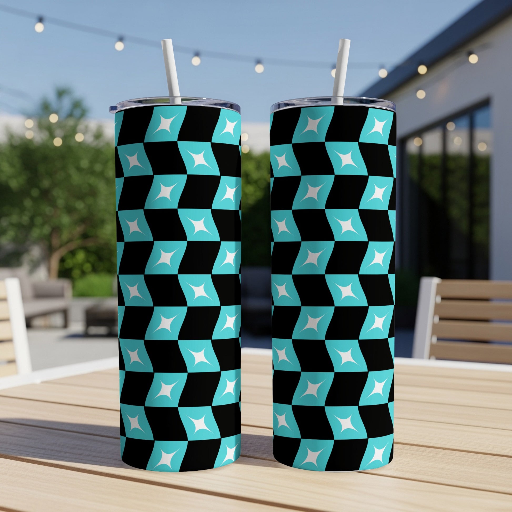 Two tall tumblers with a repeating teal and white geometric checkerboard pattern.