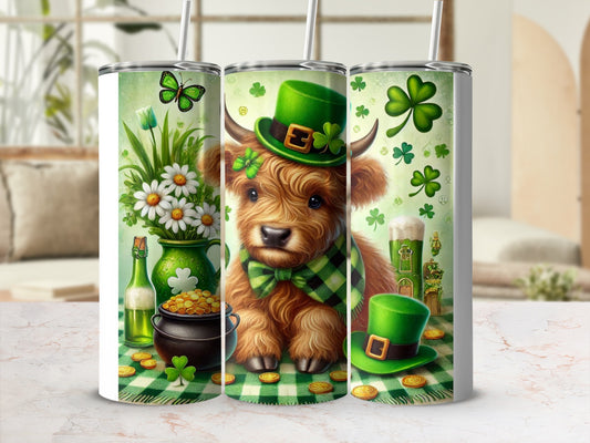 Highland cow in green hat with shamrocks and pot of gold.