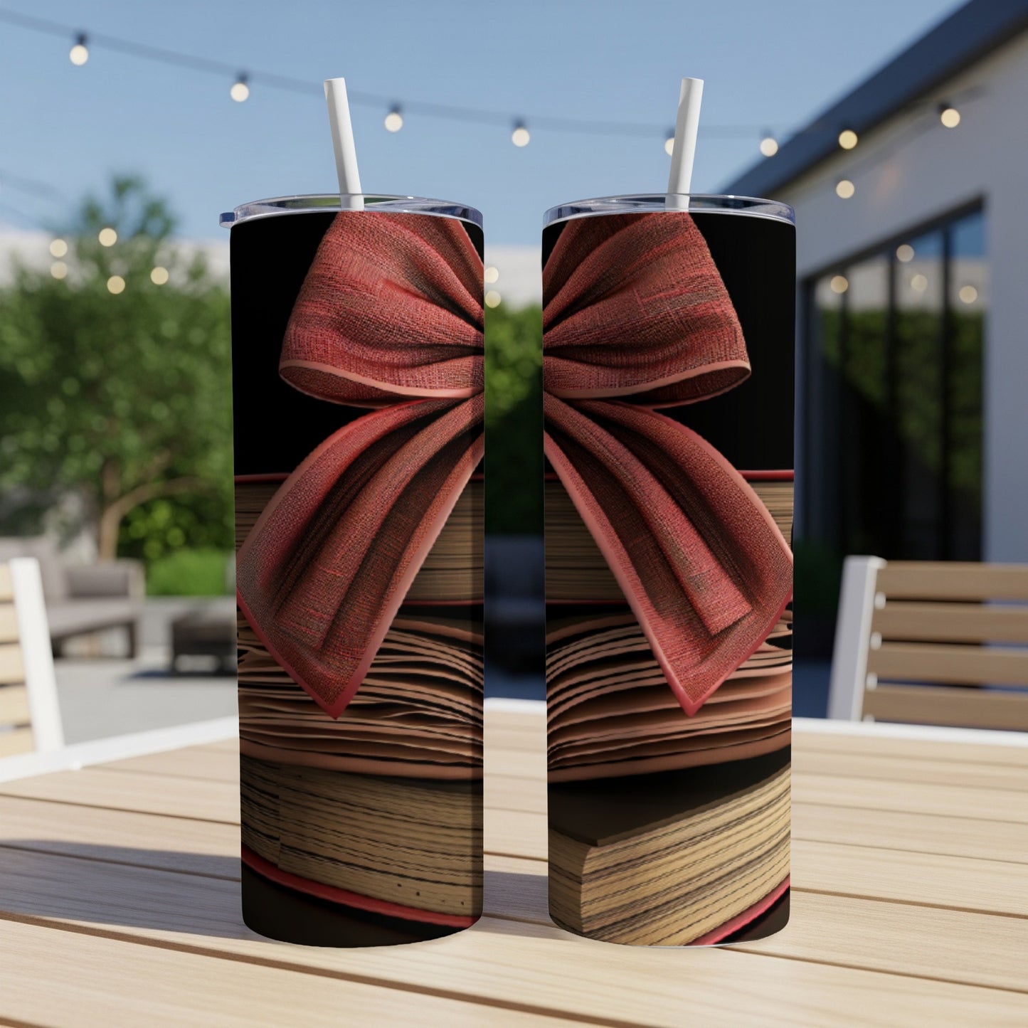 Two tumblers with a red bow and stacked books design.