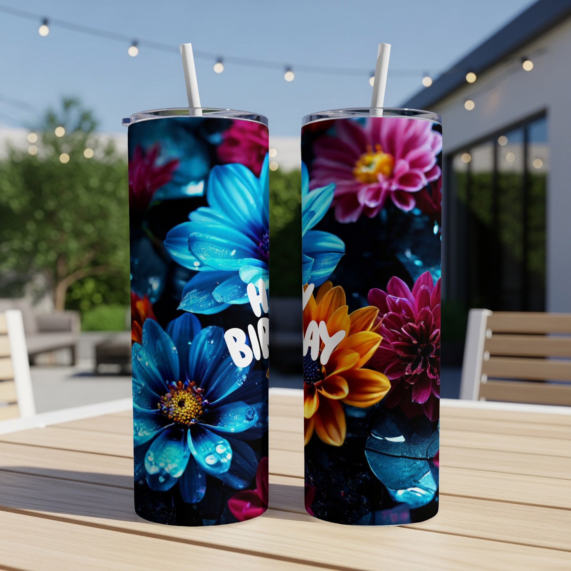 Two tumblers with vibrant floral designs, one reading "Happy Birthday".