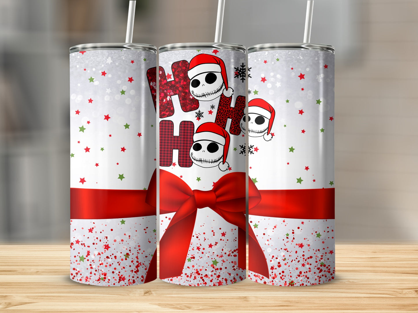 Christmas tumbler with "Ho Ho Ho" skull design and red ribbon bow.