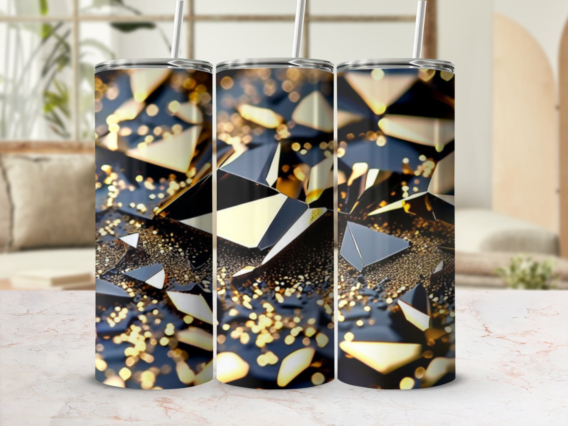 Three tumblers with abstract golden shard and sparkle design.