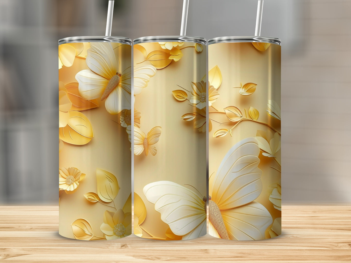 Gold tumbler with white butterflies and floral embellishments.