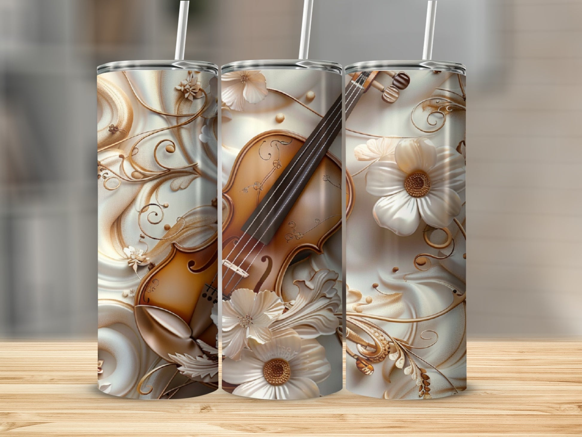 Triptych of tumblers with violin and floral ornamentation on a wooden surface.