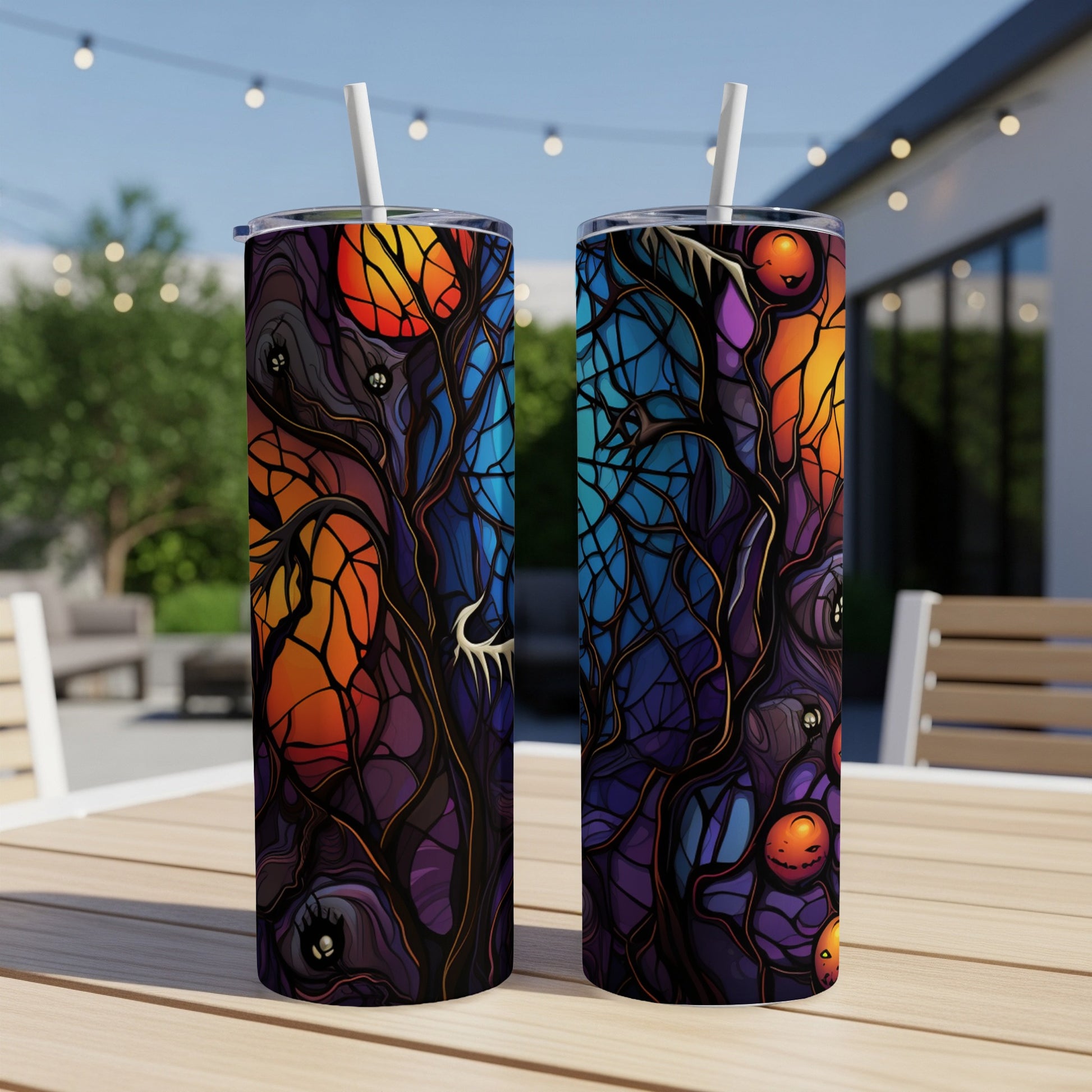 Two tumblers with a spooky, stained-glass Halloween tree design.