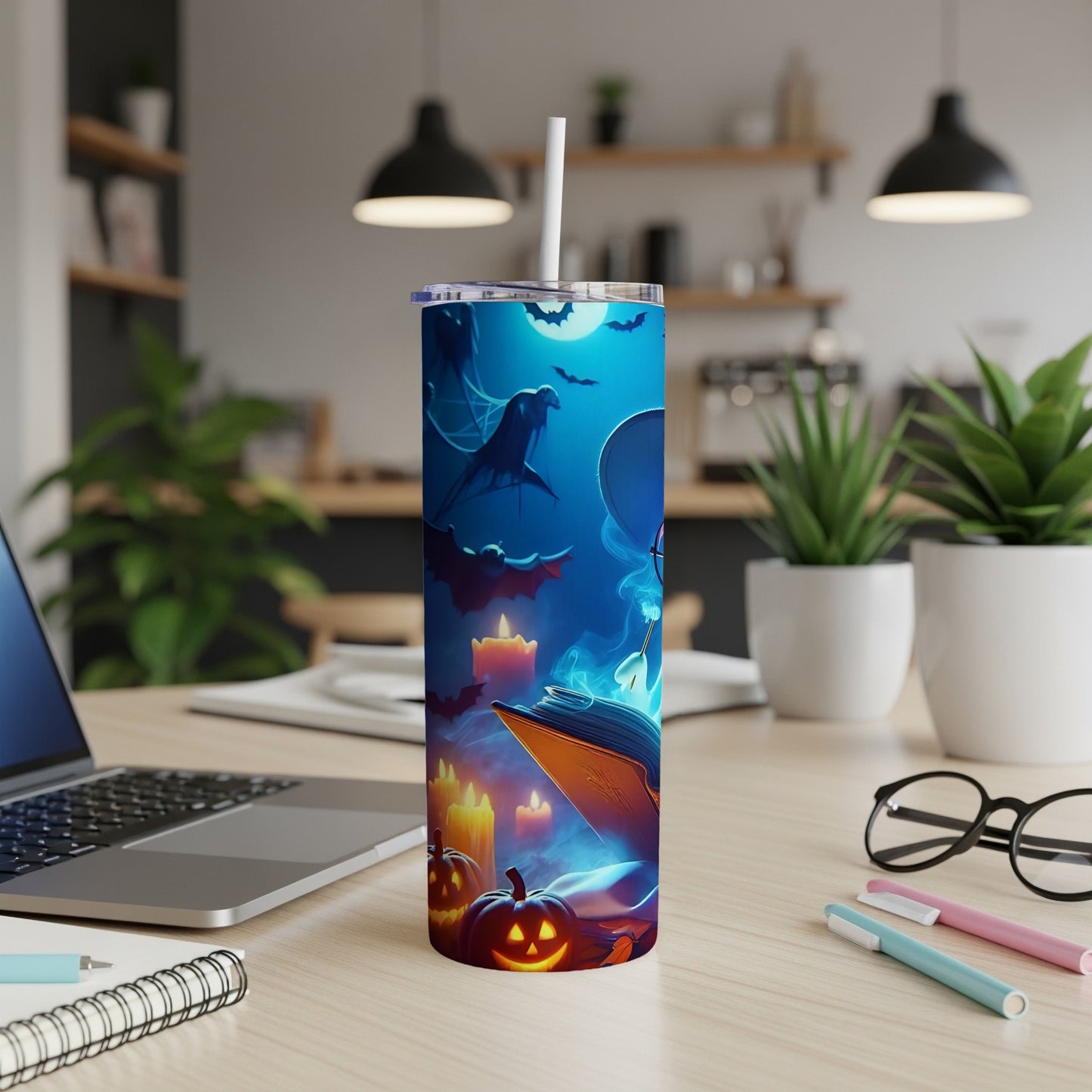 Tall tumbler with Halloween theme: spooky book, bats, moon, and jack-o'-lanterns.