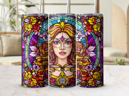 Woman's face with stained-glass floral frame on a stainless steel tumbler.