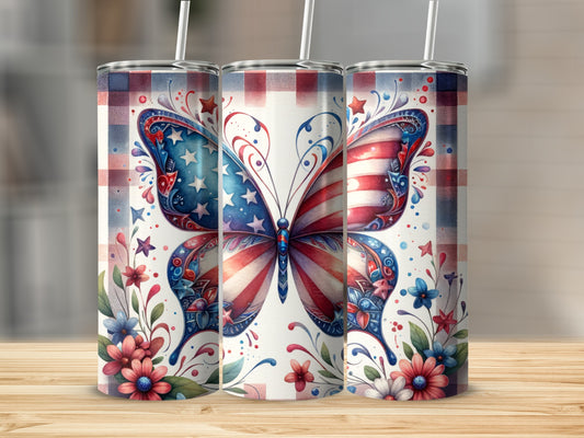 Three patriotic butterfly tumblers with floral accents on a wooden surface.