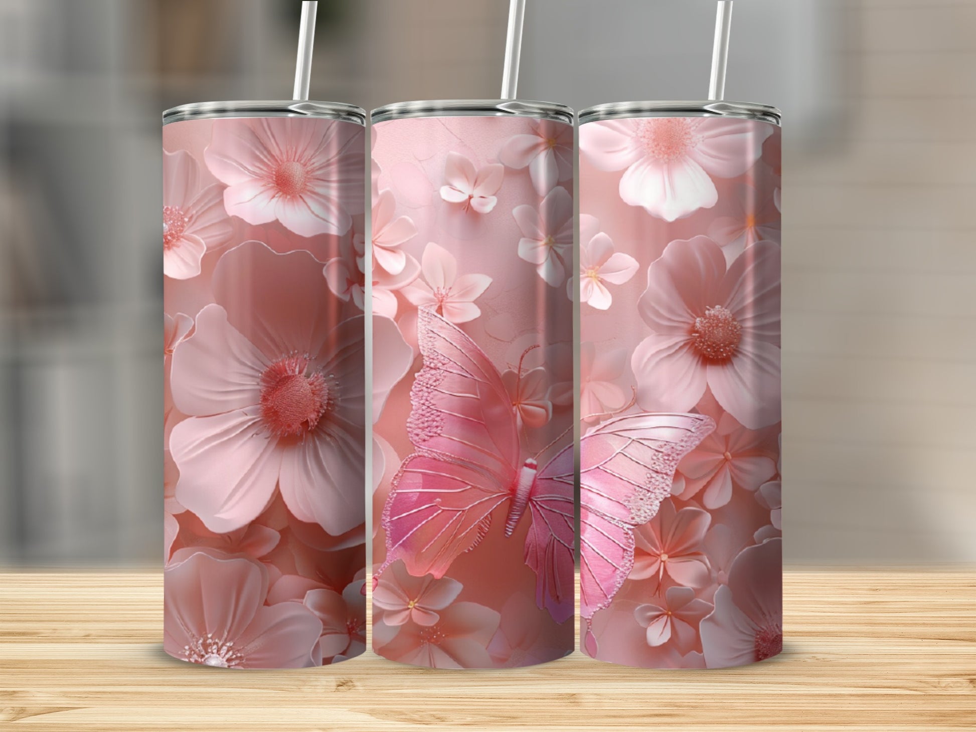 Pink floral pattern with a large pink butterfly on three tumblers.
