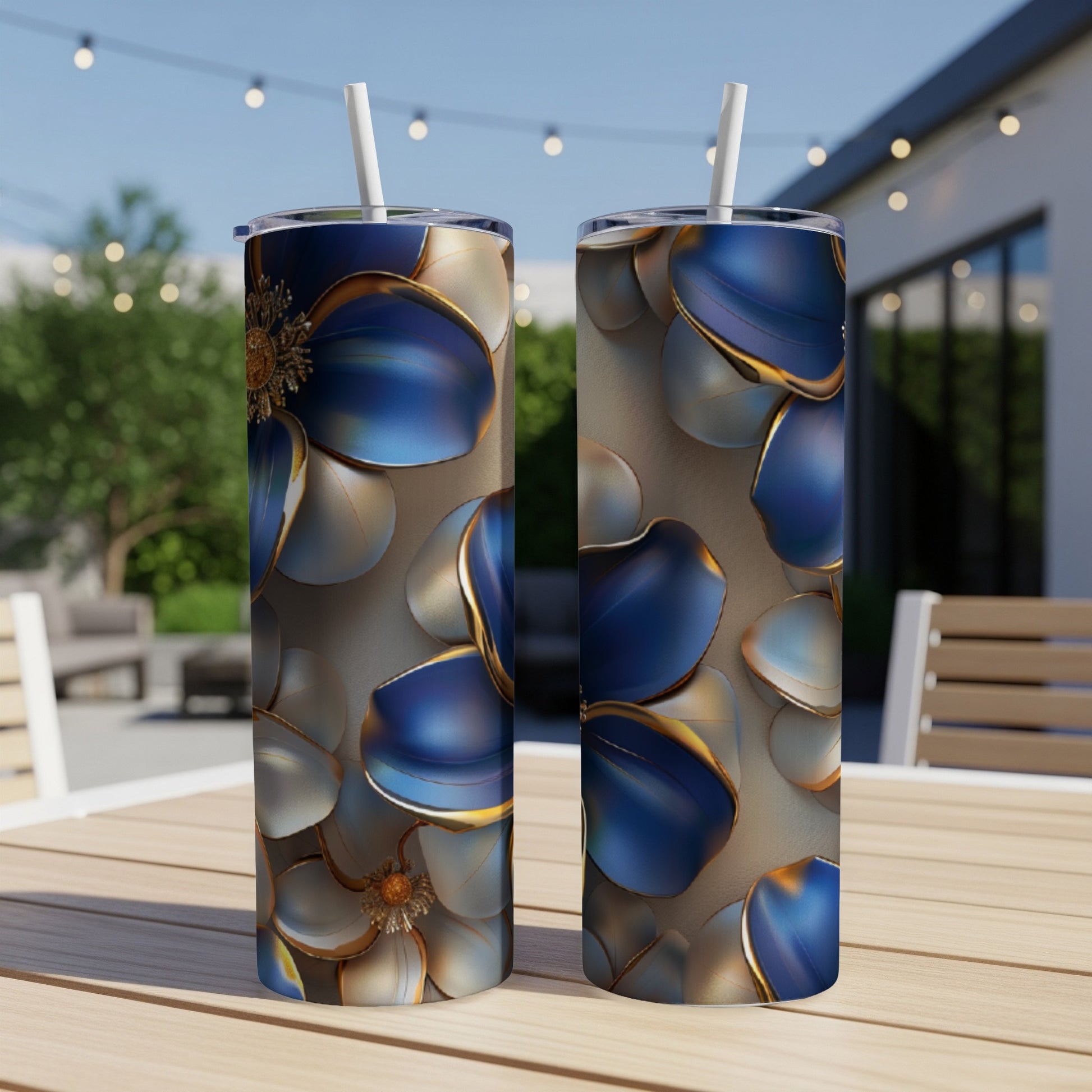 Two tall, skinny tumblers with a blue and gold floral pattern.