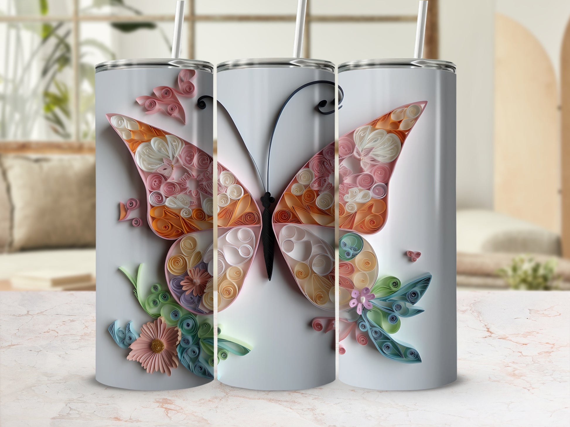 Three tumblers showcasing a colorful quilled butterfly and floral design.