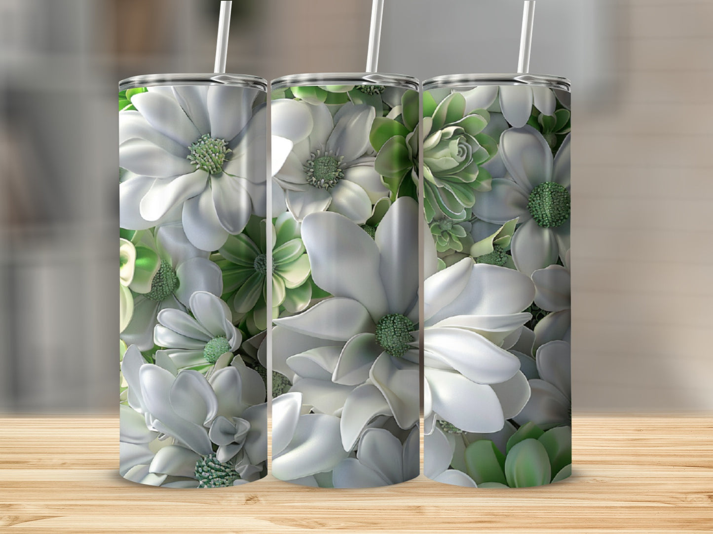 Three white floral tumblers with green succulents on a wooden surface.
