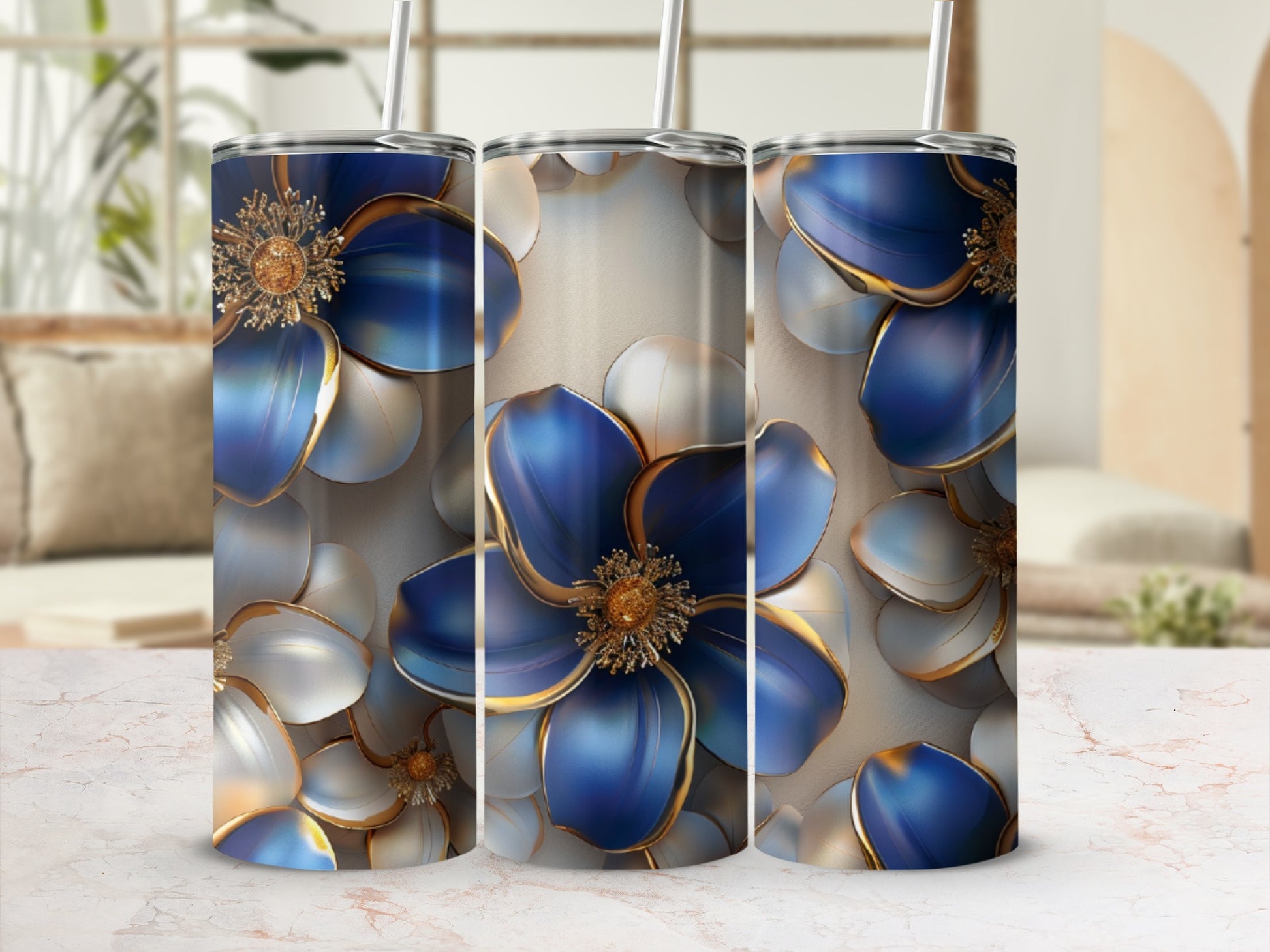 Three tumblers with blue and gold floral designs.