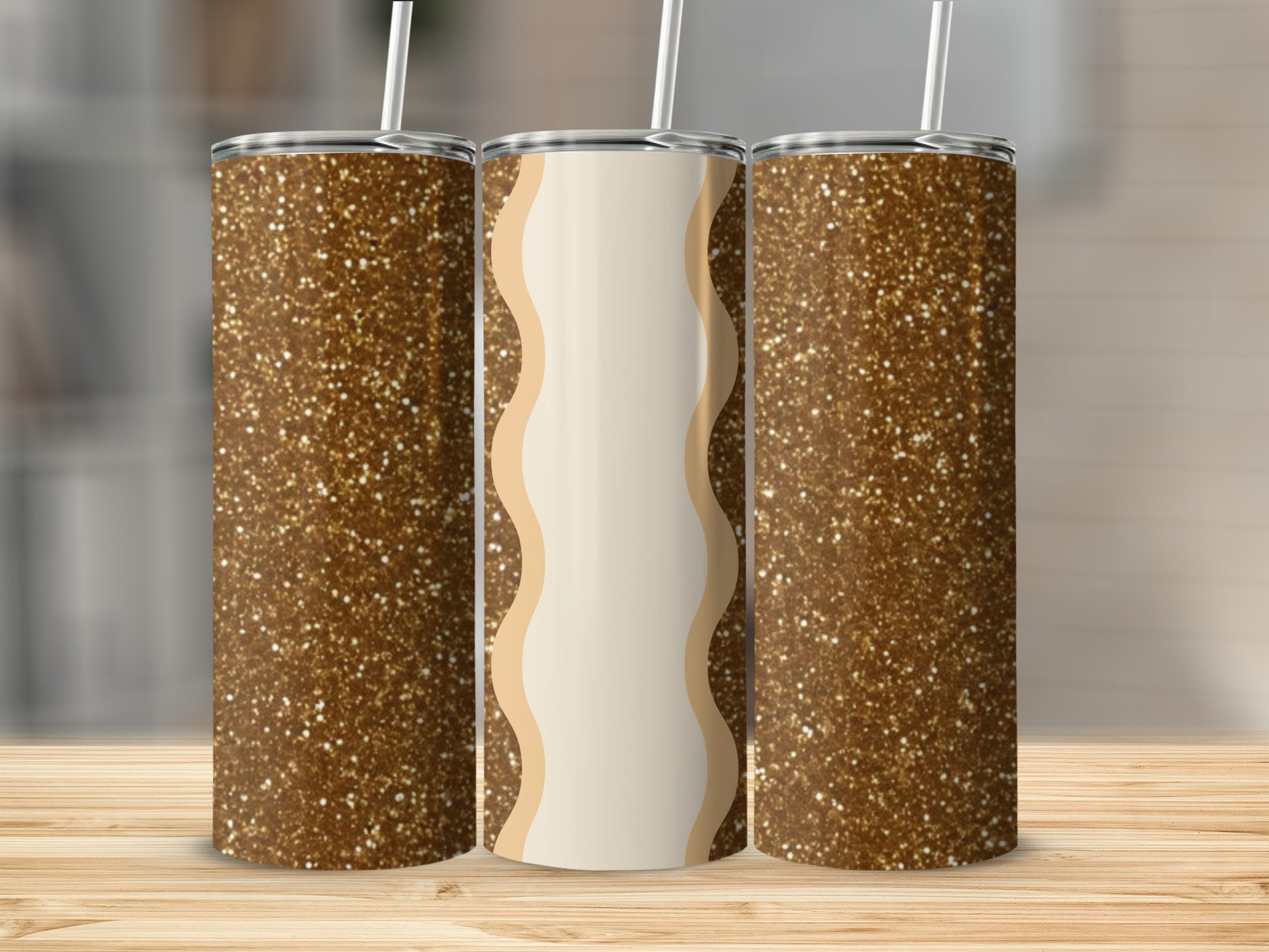 Three glitter tumblers with straws, two with brown glitter, one with wavy beige and cream design.
