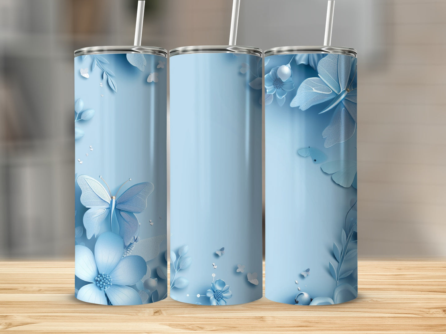 Light blue tumbler with floral and butterfly designs.