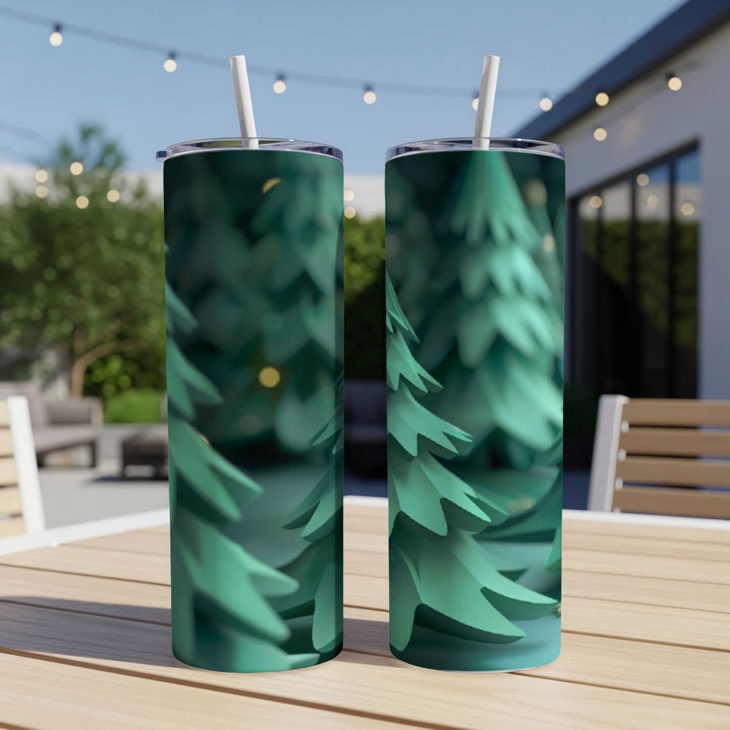 Two green tumblers with a forest pattern sit on a table.