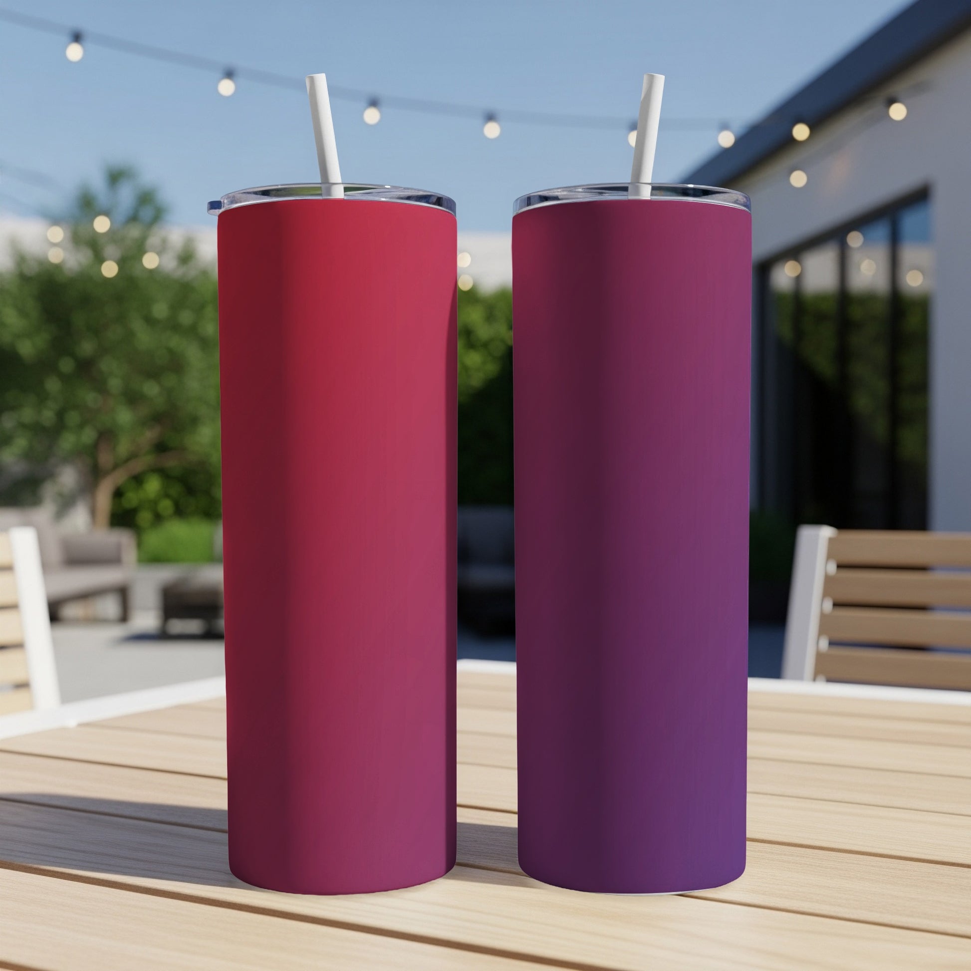 Two gradient tumblers with straws, one red to purple, one purple to red.