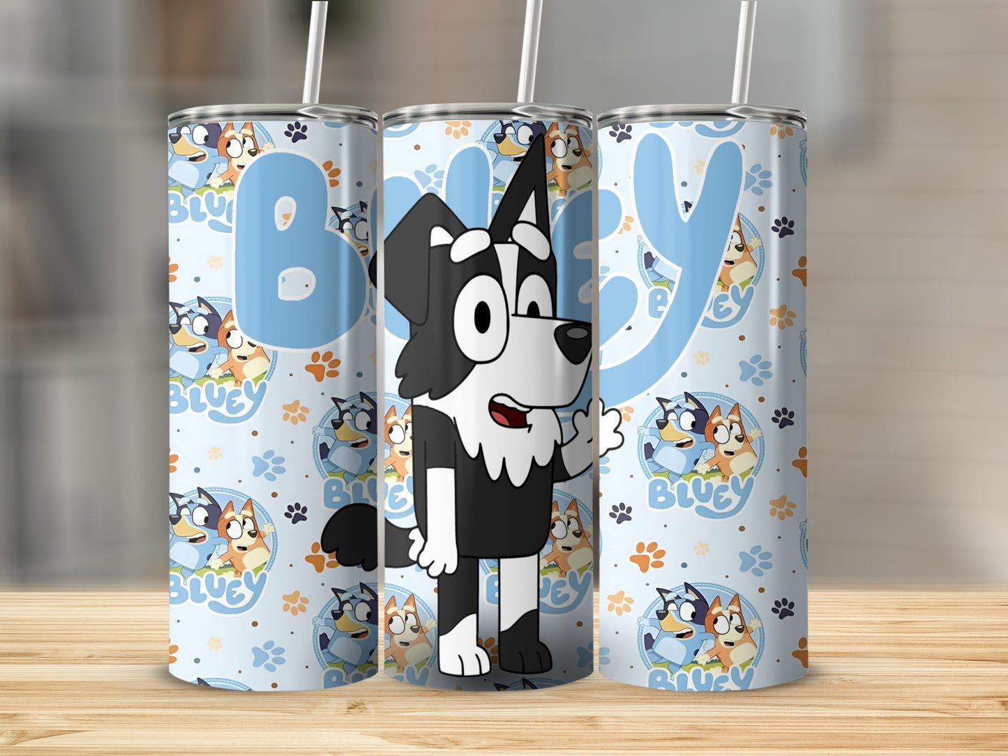 Bluey character tumbler with paw print pattern and Bluey logo.