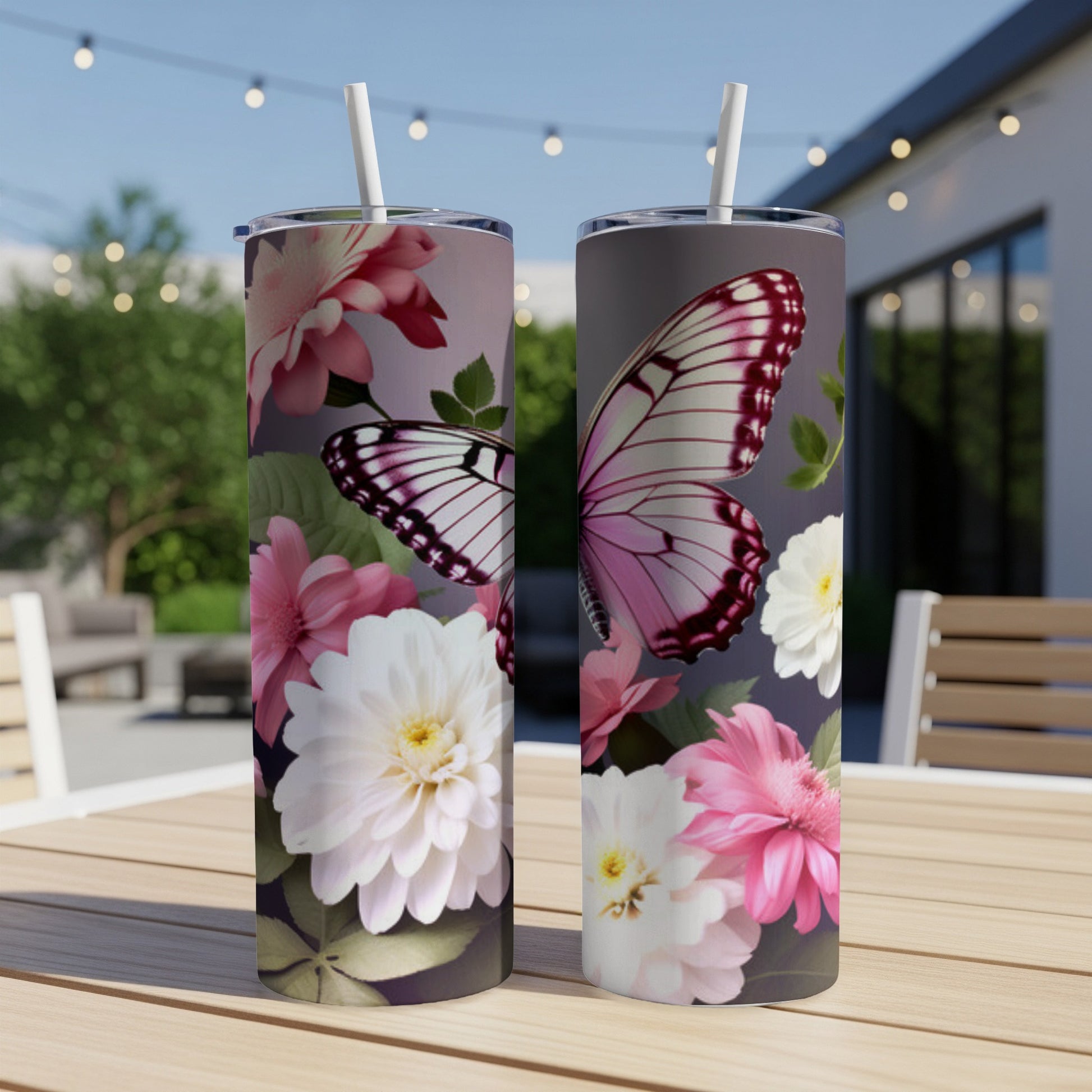 Two tumblers with pink and white flowers and a butterfly design.
