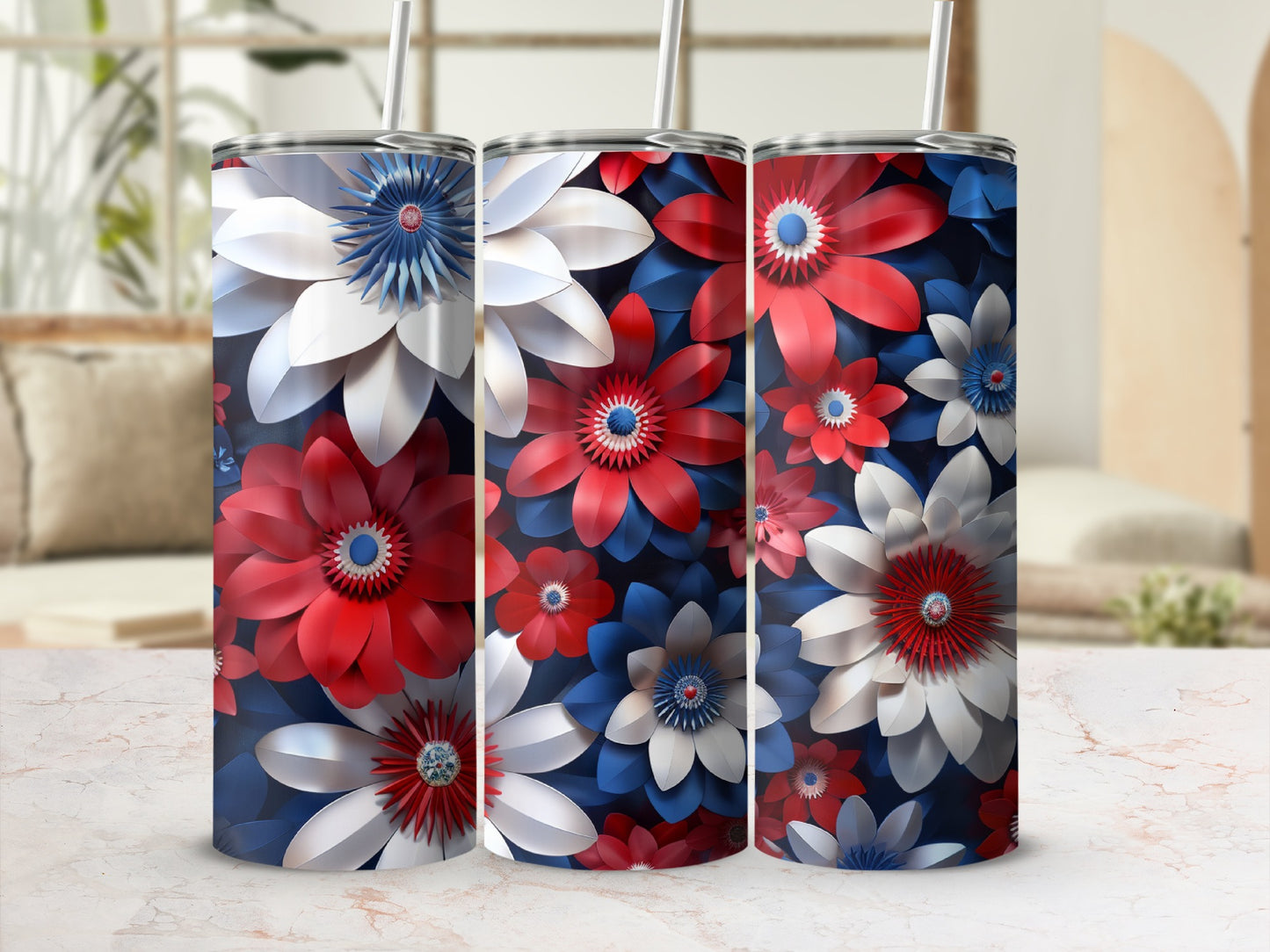 Three stainless steel tumblers with red, white, and blue floral patterns.