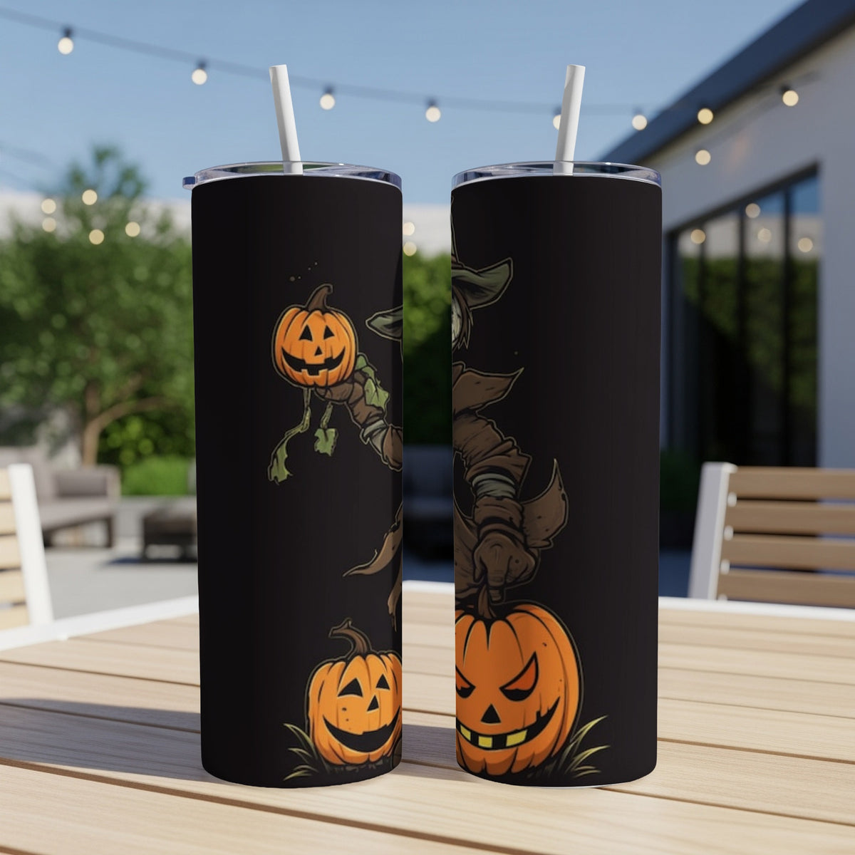 Two black tumblers featuring a Halloween scarecrow character with pumpkins.