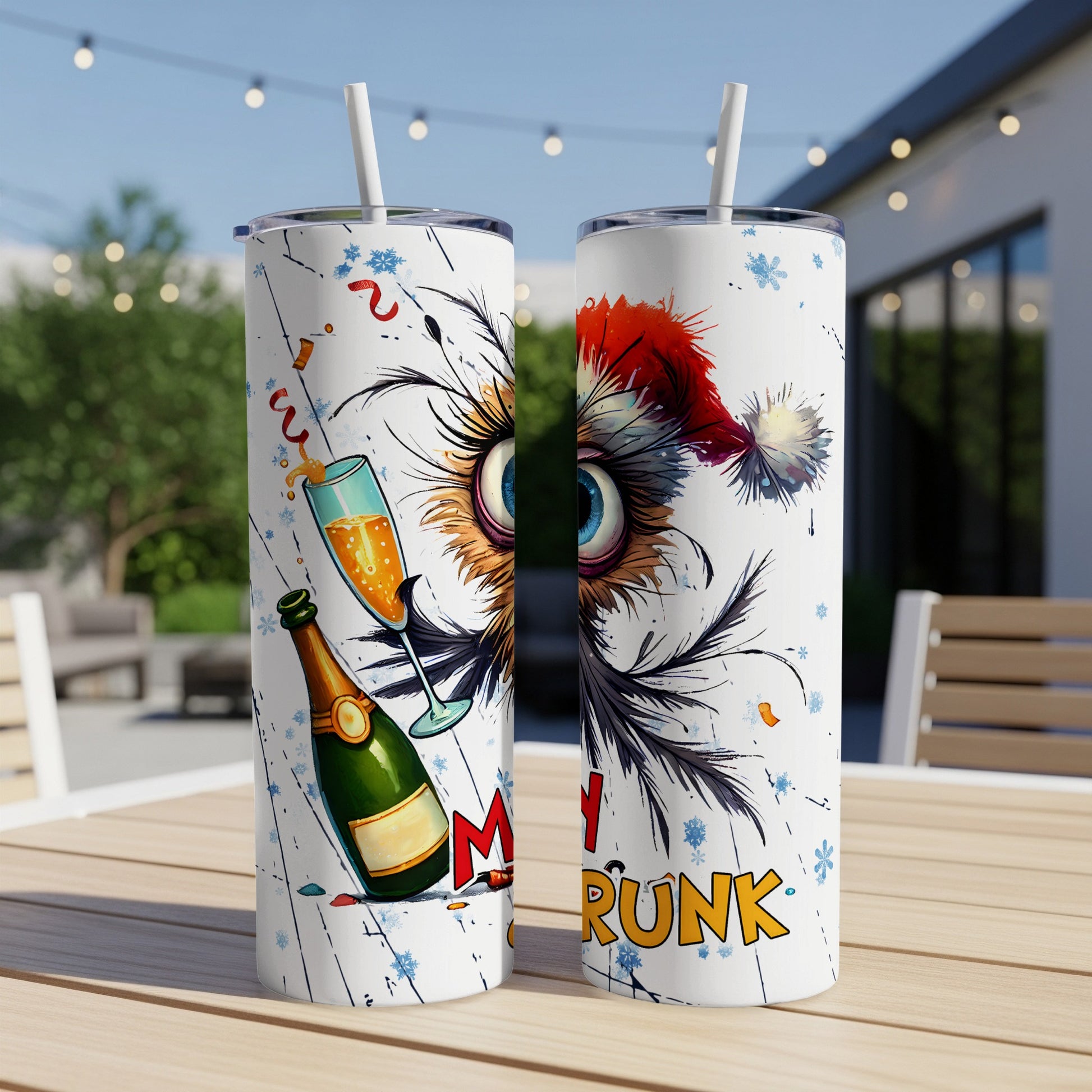 Two tumblers with a festive owl design and champagne for a "Merry Drunk" holiday.