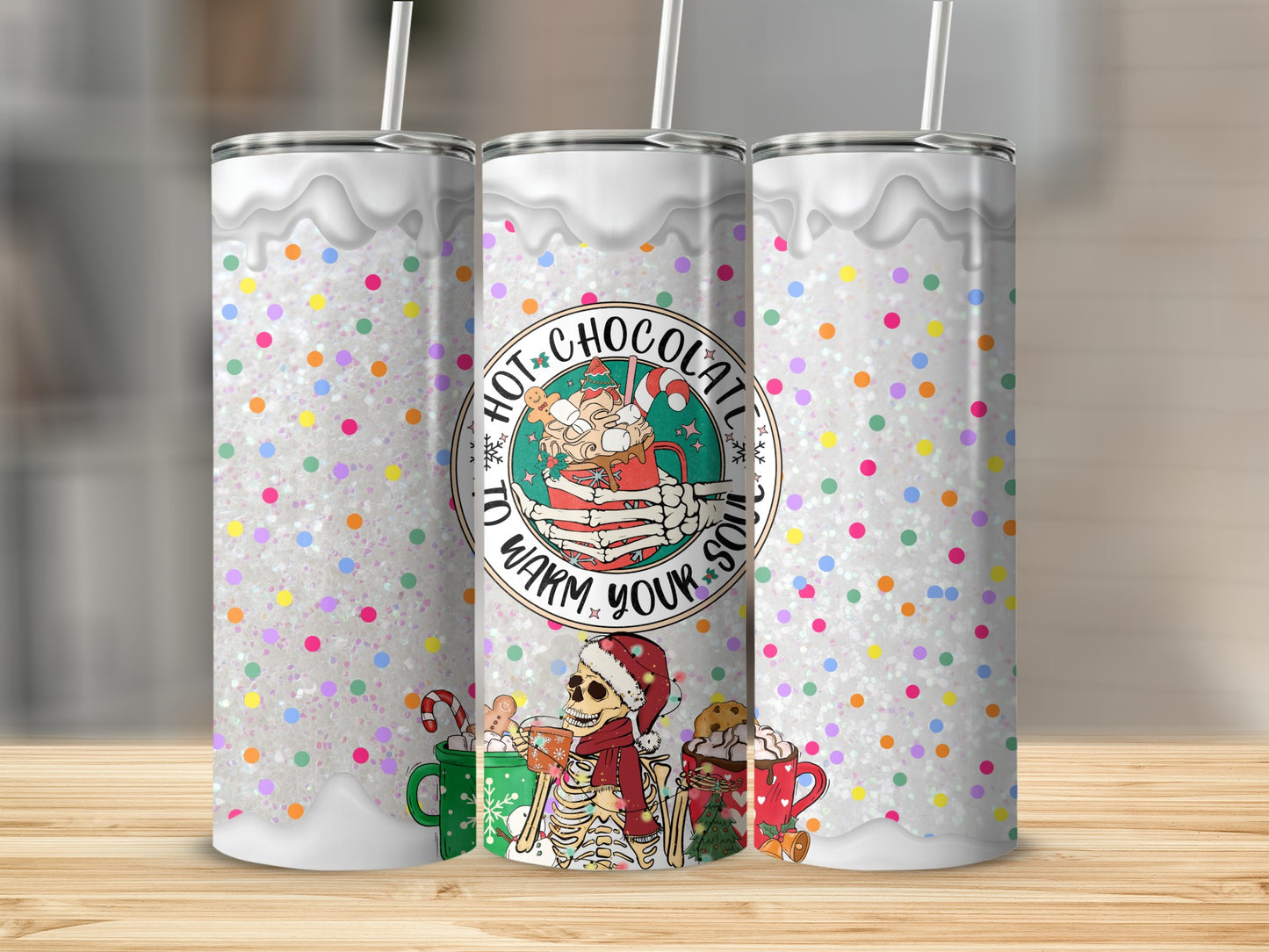 Tumbler with "Hot Chocolate to Warm Your Soul" design and festive skeleton graphics.
