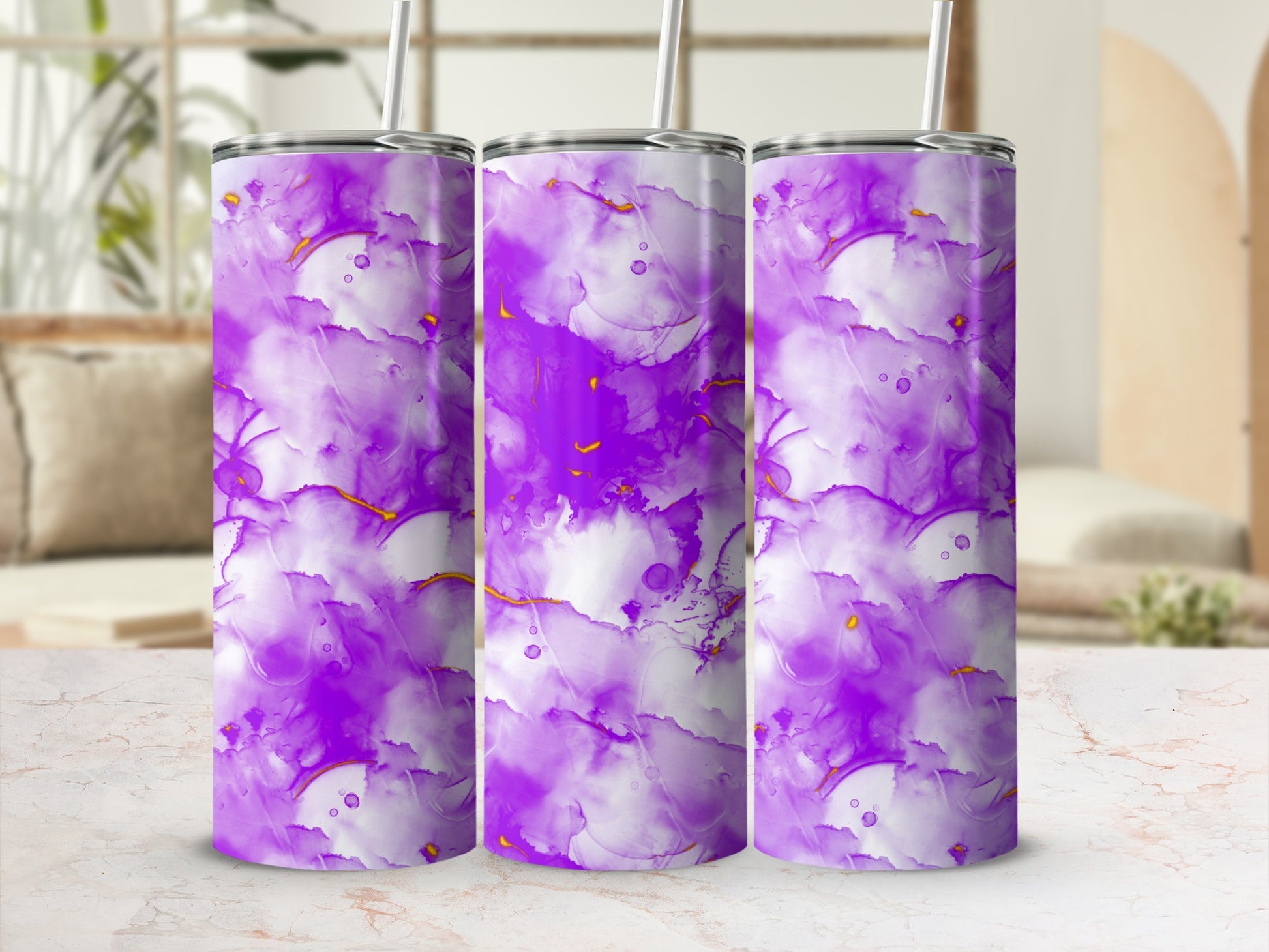 Purple and white marbled tumbler with gold accents and a straw.