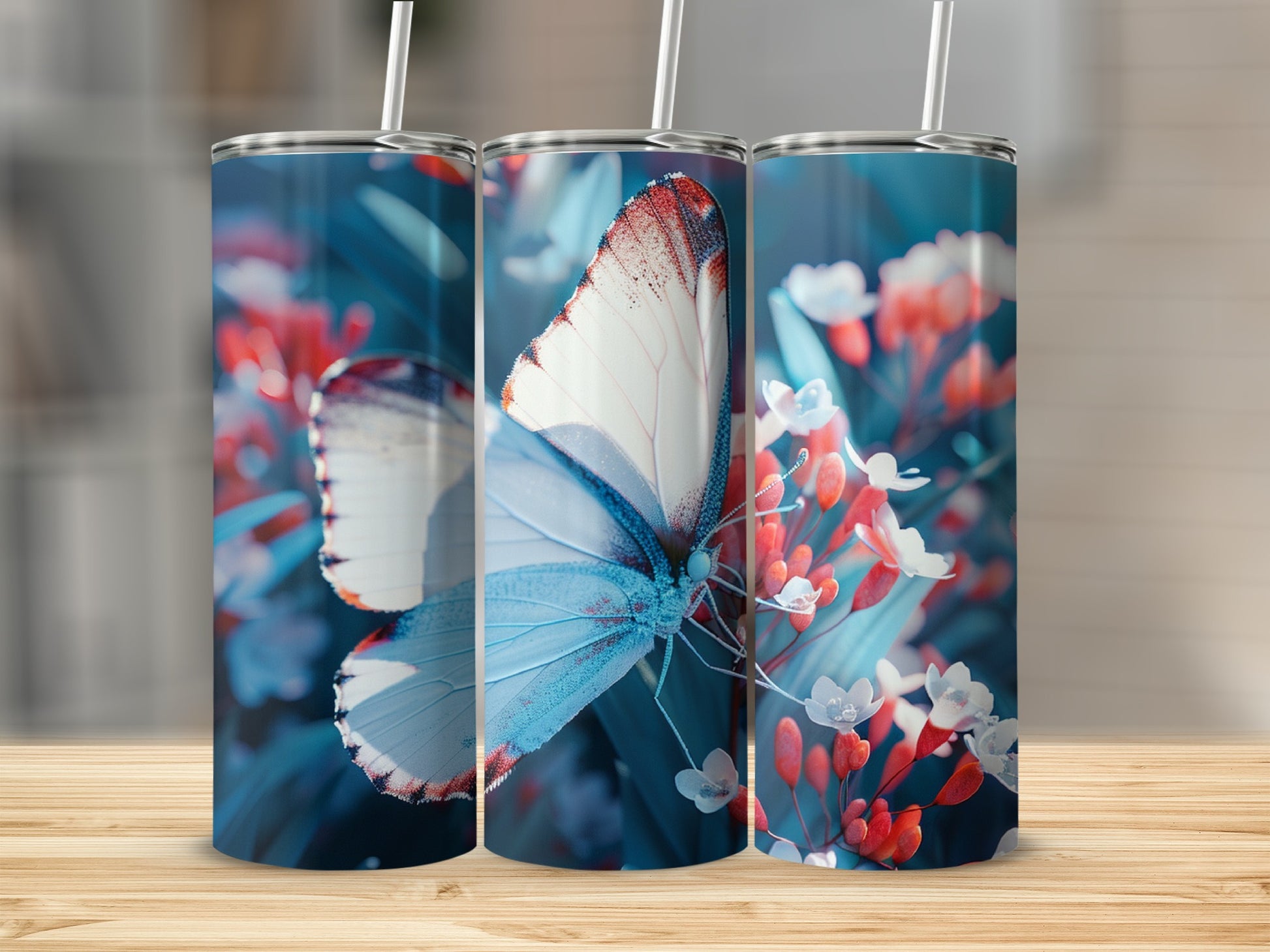 Three tumblers with a blue butterfly and floral design.