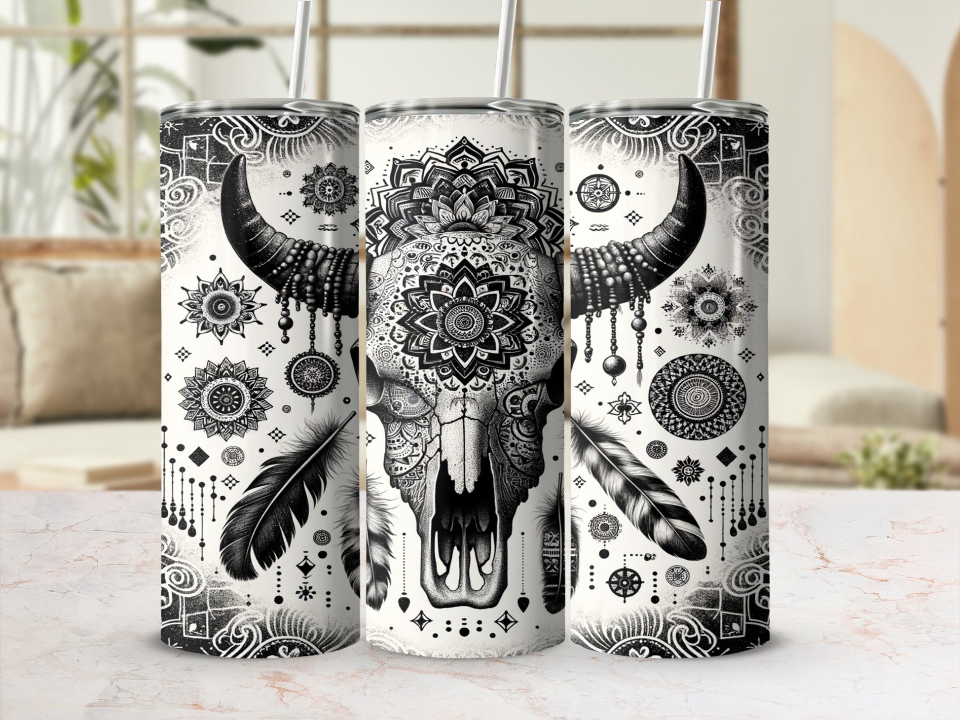 Black and white bull skull with mandala and feather design on tumbler.