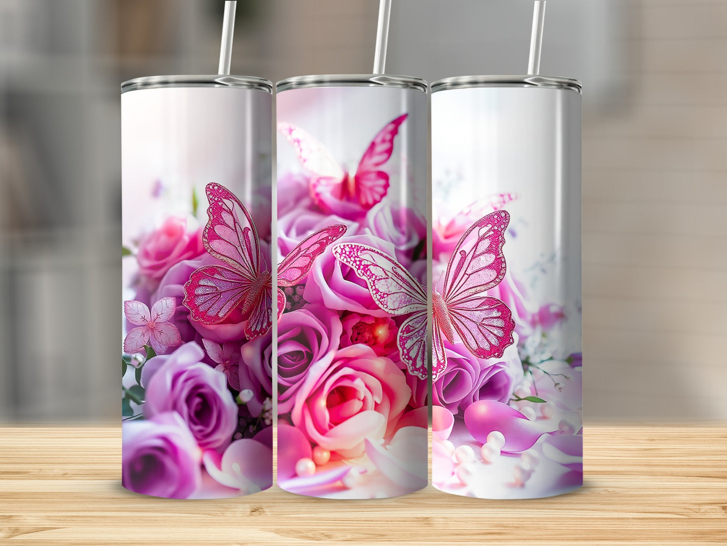 Three tumblers with a pink butterfly and rose floral design.
