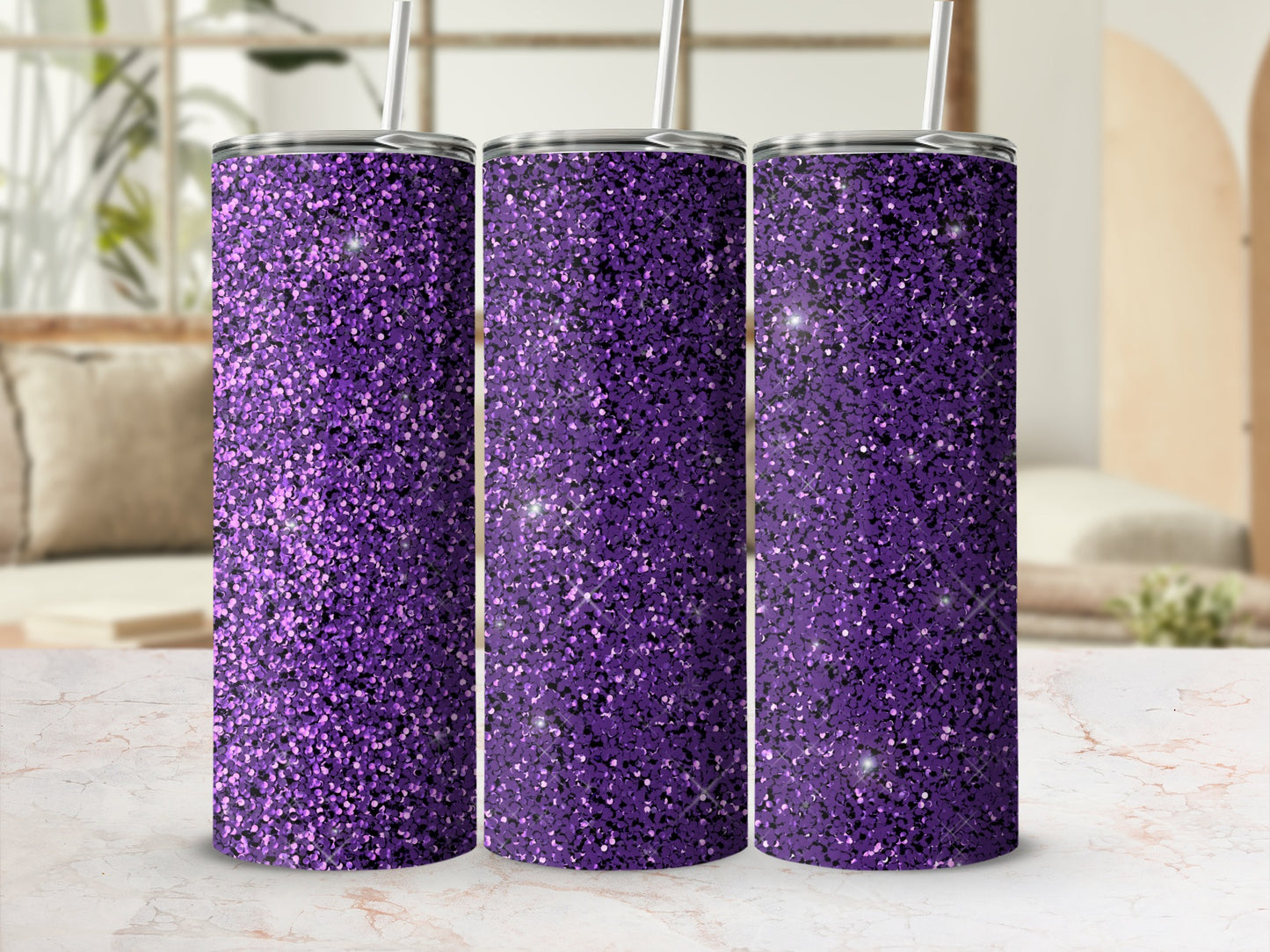 Purple glitter tumbler with straw in a studio setting.